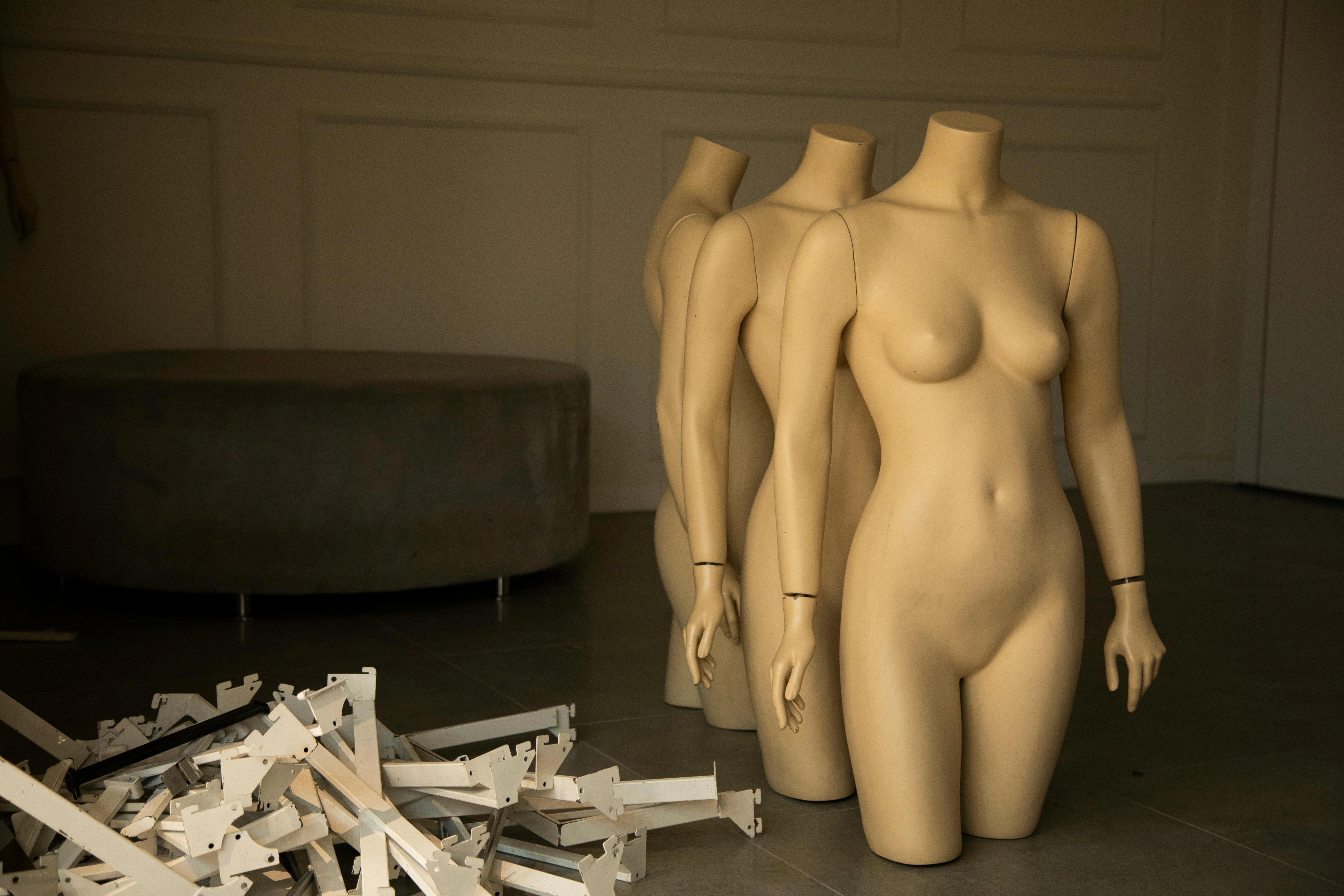 Fashion atelier with mannequins arranged in a minimalist studio
