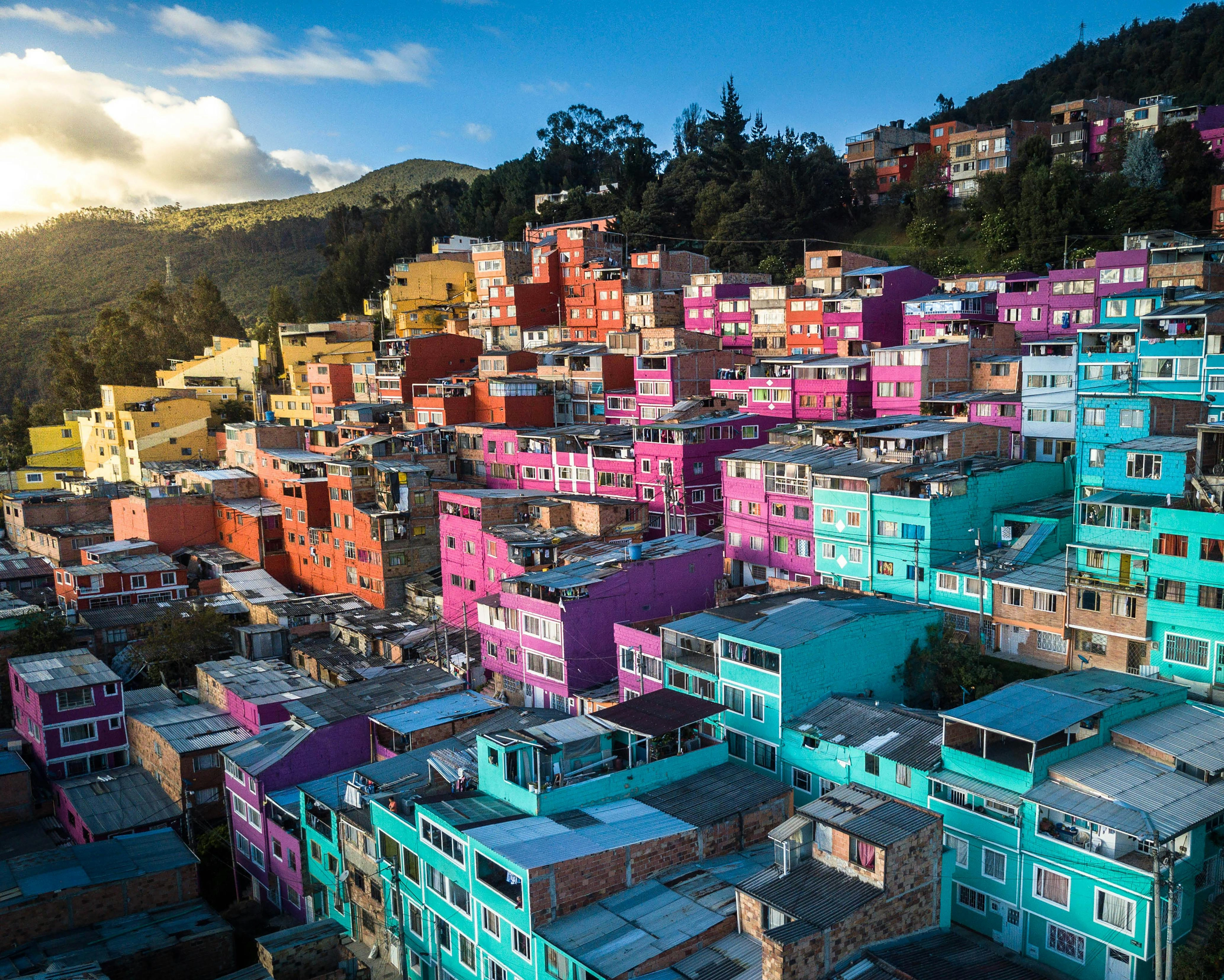 Colorful hillside houses in a Latin American urban landscape
